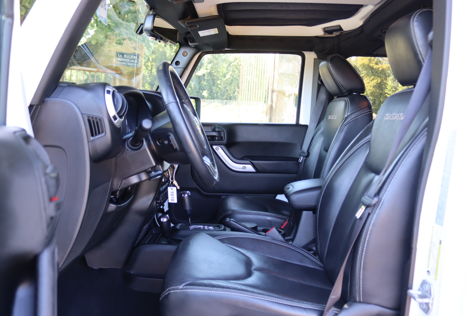 Photo Jeep Wrangler Unlimited Sahara 3.6 v6 284 ch avec la bache pour l'été