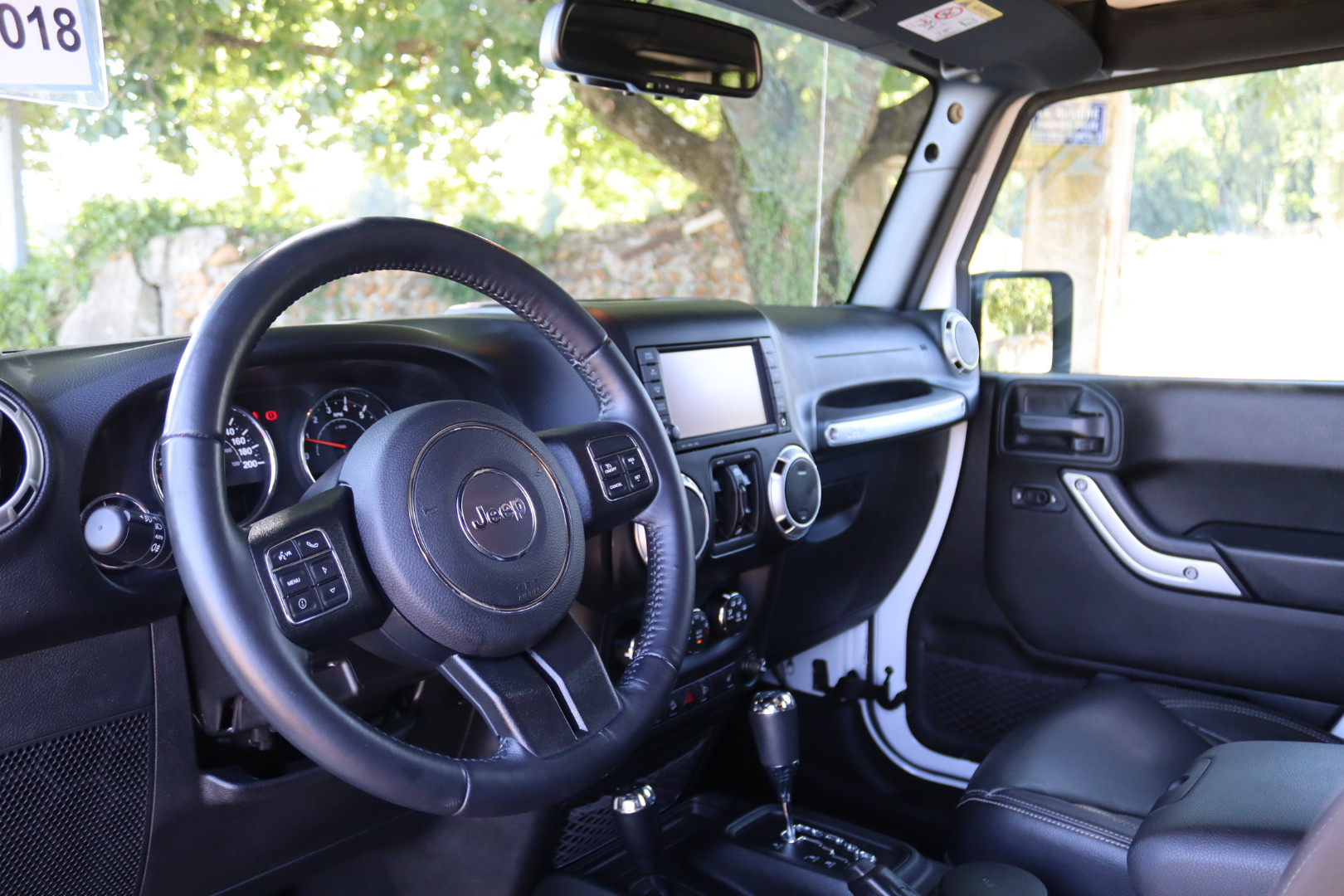 Photo Jeep Wrangler Unlimited Sahara 3.6 v6 284 ch avec la bache pour l'été